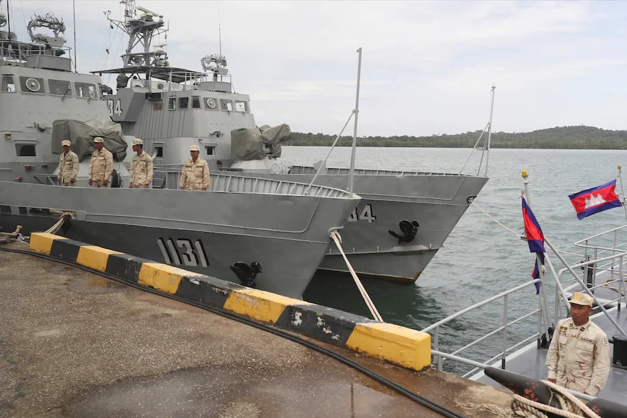 Cambodian navy crew stand on a patrol boat at the Ream Naval Base in Sihanoukville, southwest of Phnom Penh, Cambodia