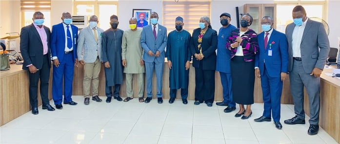 Members of the newly-inducted NPA-ACTU in a group photograph with the representative of the Acting Managing Director, NPA, Prof. Idris Abubakar (middle), and other