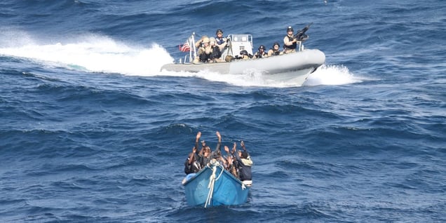 US security forces approach a suspected pirate vessel. Photo- US Navy, Public Domain